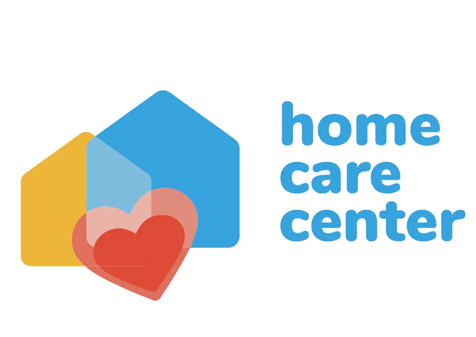 Uma ilustração minimalista e colorida que representa dois formatos de casa e um coração, simbolizando lar, cuidado ou bem-estar.

O objeto principal é composto por duas formas geométricas de casa (silhuetas de casas simples com telhados triangulares).

Uma casa, menor e em amarelo-alaranjado, está posicionada ligeiramente à esquerda e atrás.

A outra casa, maior e em azul brilhante, está à direita e ligeiramente à frente.

Na frente e no centro da imagem, sobrepondo parcialmente as duas casas, há um grande coração vermelho. Ele tem uma sobreposição transparente ou uma segunda camada de coração em um tom de rosa - claro ou vermelho mais suave, dando um efeito de profundidade ou brilho.