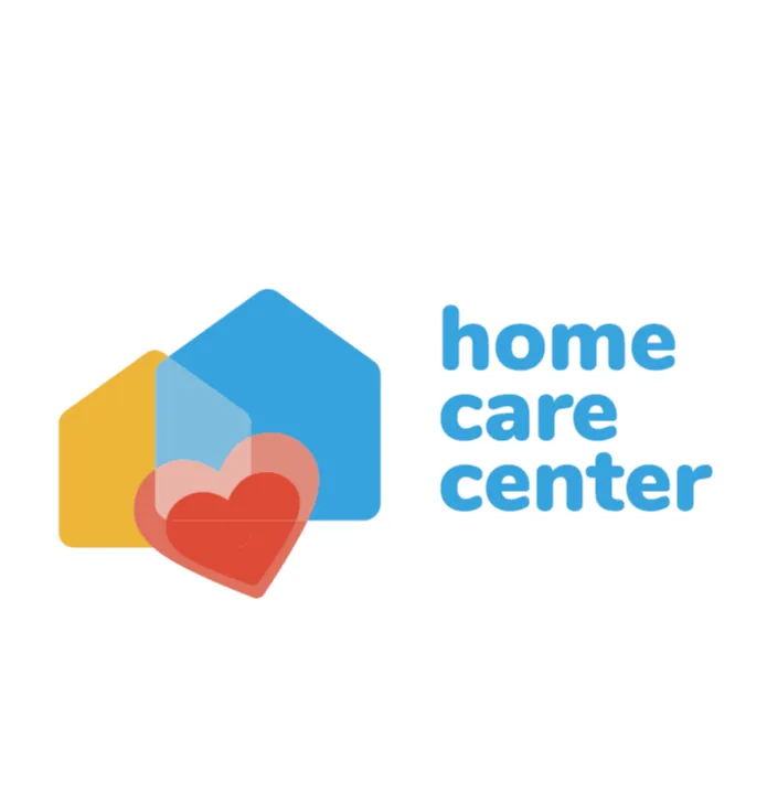 Uma ilustração minimalista e colorida que representa dois formatos de casa e um coração, simbolizando lar, cuidado ou bem-estar.

O objeto principal é composto por duas formas geométricas de casa (silhuetas de casas simples com telhados triangulares).

Uma casa, menor e em amarelo-alaranjado, está posicionada ligeiramente à esquerda e atrás.

A outra casa, maior e em azul brilhante, está à direita e ligeiramente à frente.

Na frente e no centro da imagem, sobrepondo parcialmente as duas casas, há um grande coração vermelho. Ele tem uma sobreposição transparente ou uma segunda camada de coração em um tom de rosa - claro ou vermelho mais suave, dando um efeito de profundidade ou brilho.
