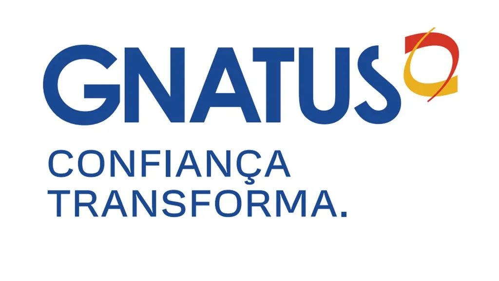 Nome da empresa escrito em azul com o logotipo, que representa uma mandíbula, em amarelo e vermelho.