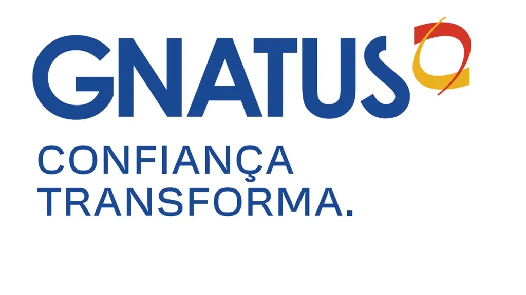 Nome da empresa escrito em azul com o logotipo, que representa uma mandíbula, em amarelo e vermelho.