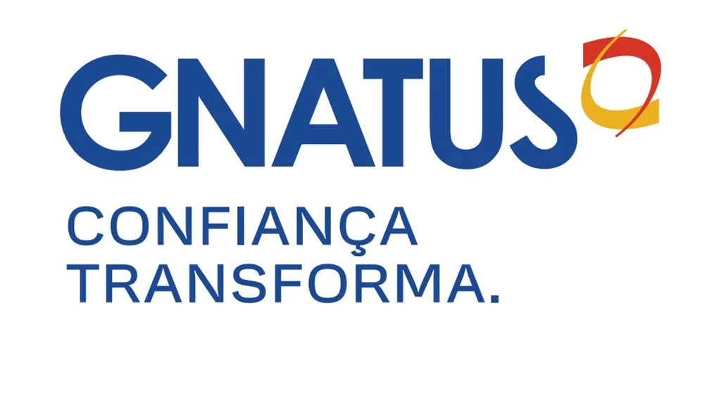 Nome da empresa escrito em azul com o logotipo, que representa uma mandíbula, em amarelo e vermelho.
