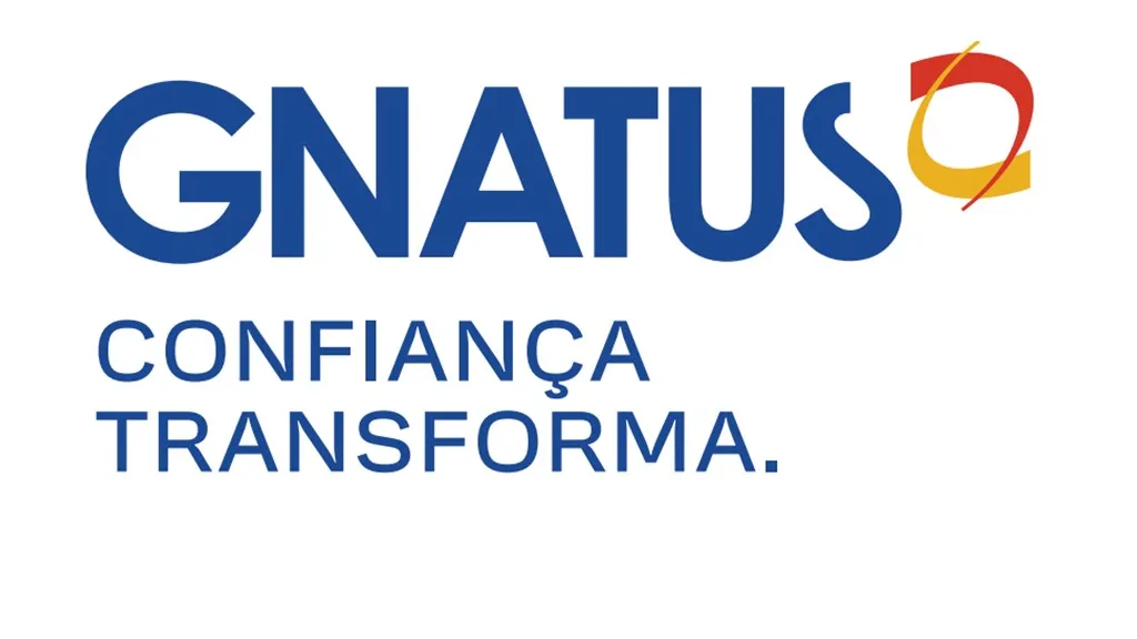 Nome da empresa escrito em azul com o logotipo, que representa uma mandíbula, em amarelo e vermelho.