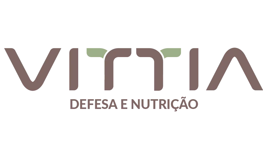 Esta imagem contém a palavra Vittia em marrom que é o nome da empresa. Na segunda linha está escrito "Defesa e Nutrição" também em marrom.